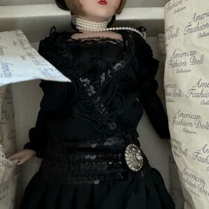 Lady with black formal dress , 17 inch. Never used with pearl necklace